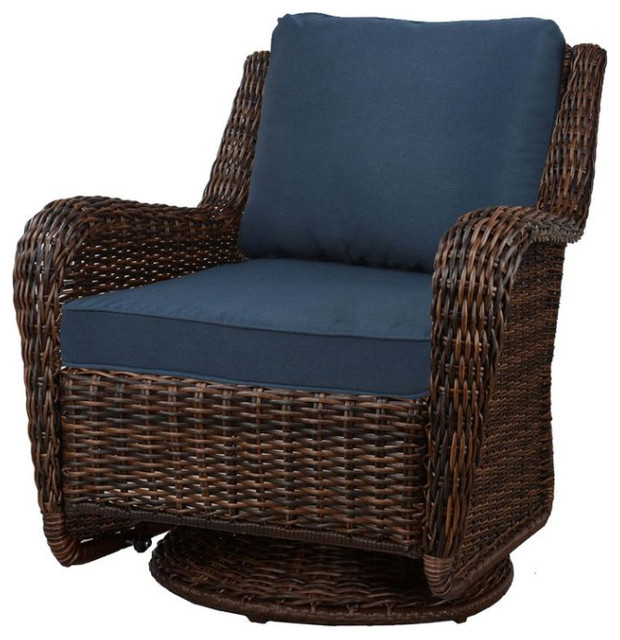 Brown Wicker Swivel Outdoor Rocking Chair With Blue Cushions .