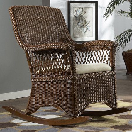 Hand-woven wicker rocking chair with a rattan frame. Product .