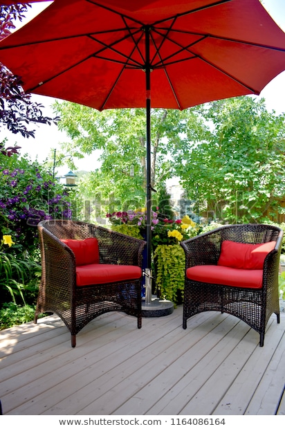 Red Patio Furniture Under Umbrella On Stock Photo (Edit Now .