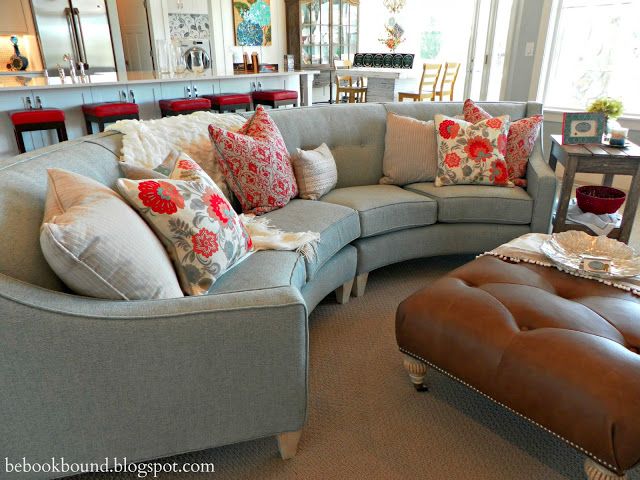 Living Room semi circular sofa sectional in a lovely blue gray .