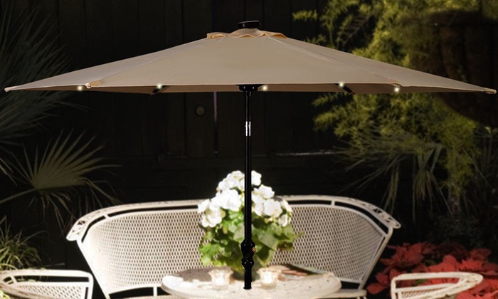 9 Ft. Patio Umbrella with Solar-Powered LED Lights and Hand Crank .