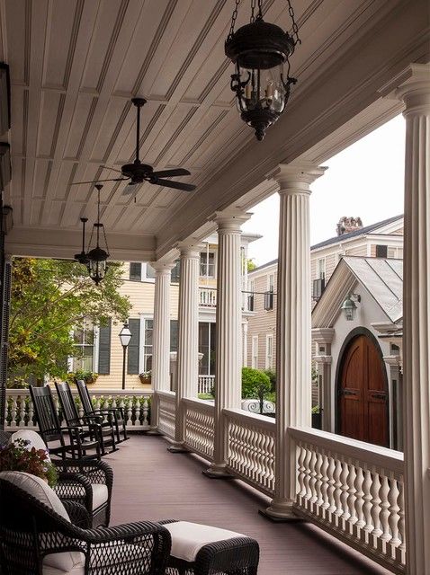 porch pillars Porch Victorian with black wicker furniture ceiling .