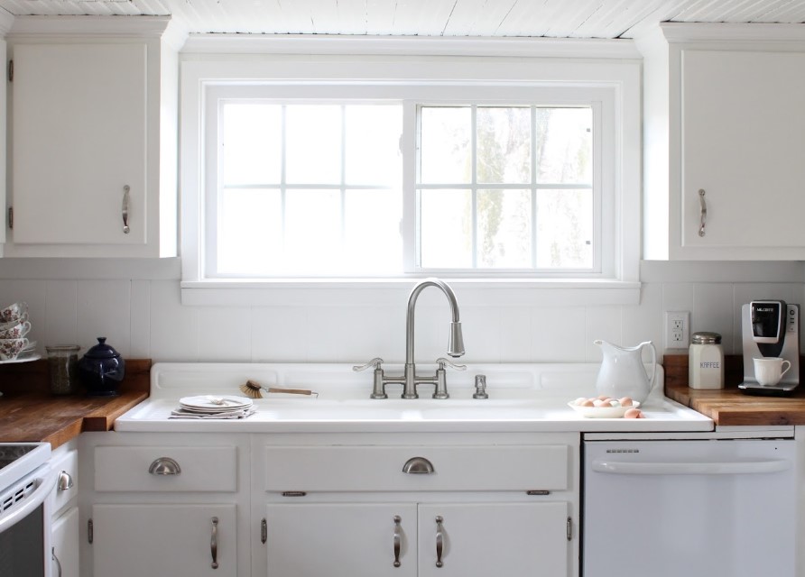Cozy kitchen cabinet with double window