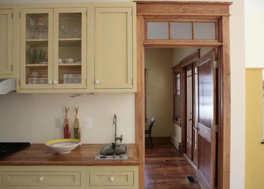 Unfinished kitchen cabinet with arched shelf