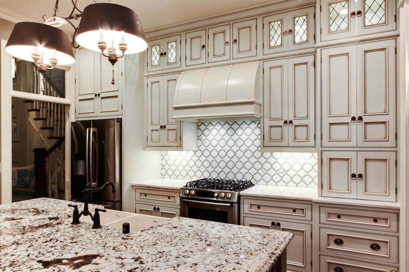 Kitchen back wall made of black and white hexagonal tiles white