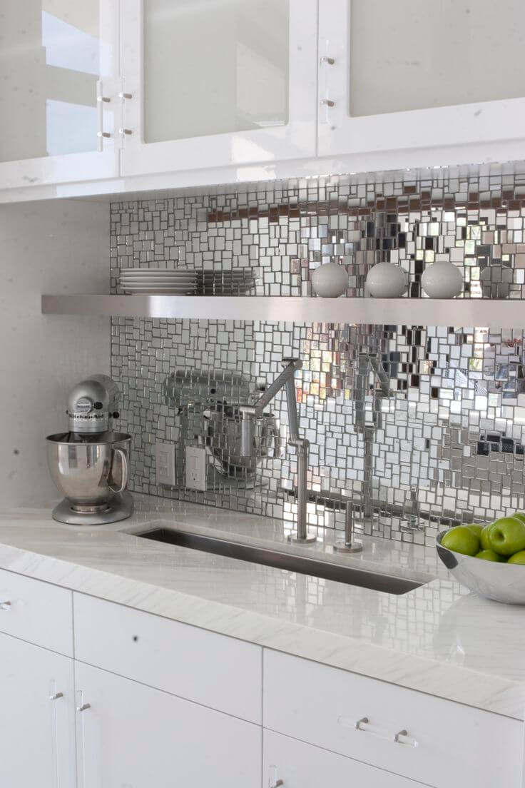 Kitchen back wall made of metal with mosaic 