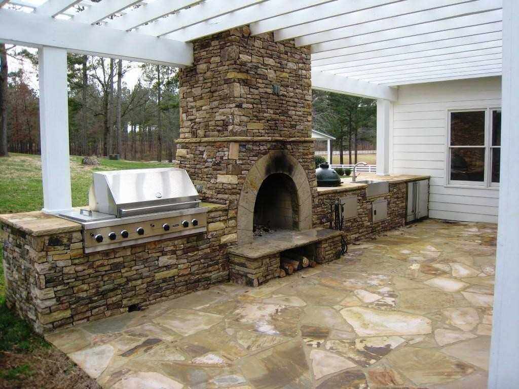 Outside kitchen with earthy fireplace