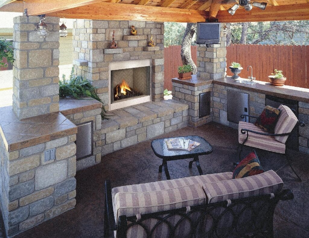 Outdoor kitchen with a trendy fireplace