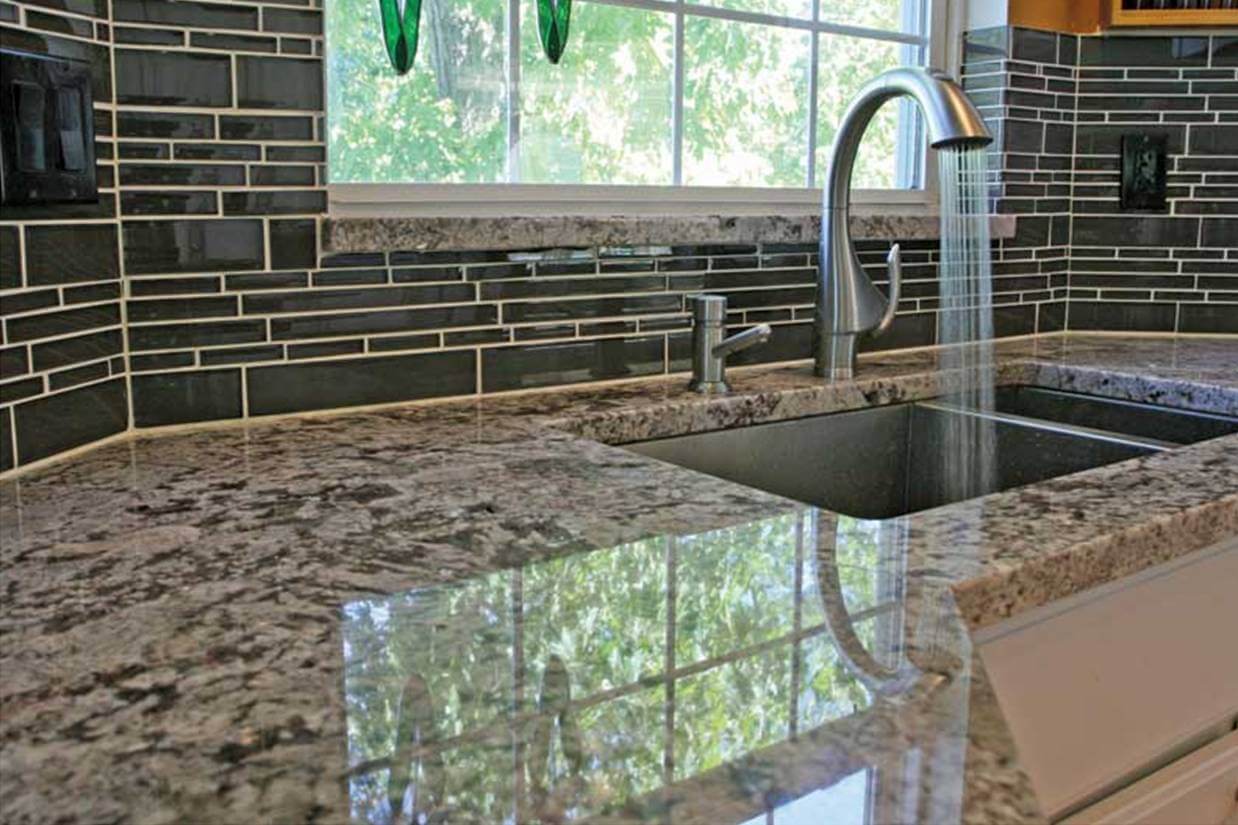Cool kitchen splashback made of glass tiles
