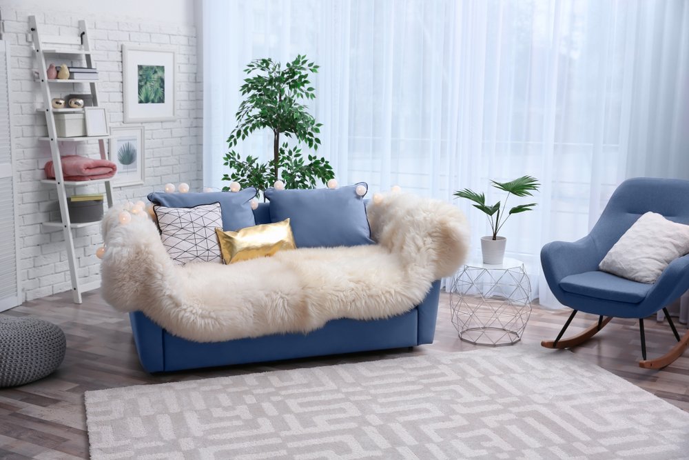 Soft blue couch with furry fabrics in the mini area