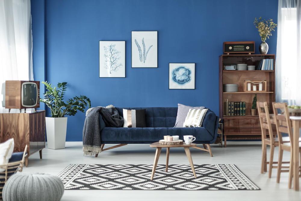 Mid-century dark blue couch in living room