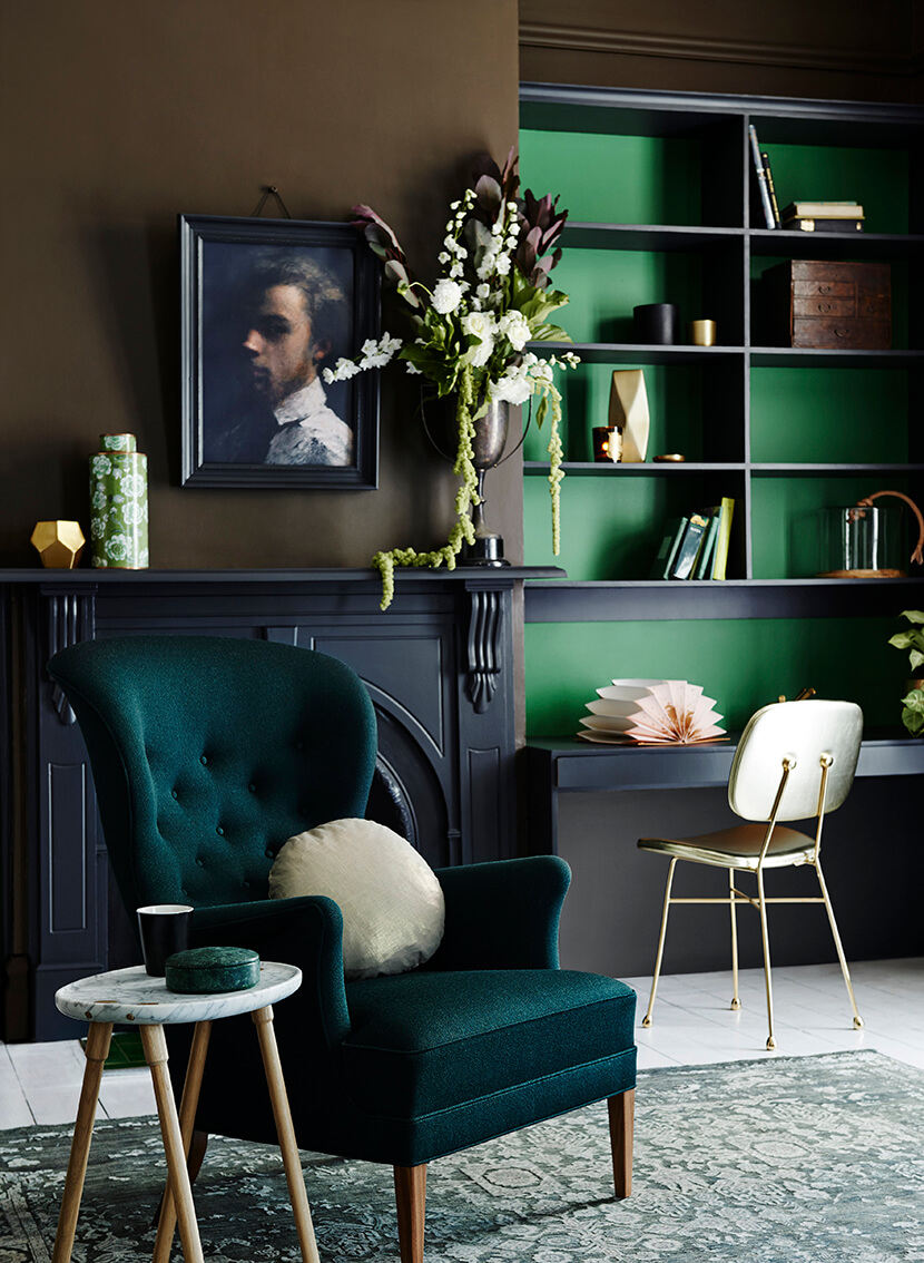 Blue-green living room with wing chair