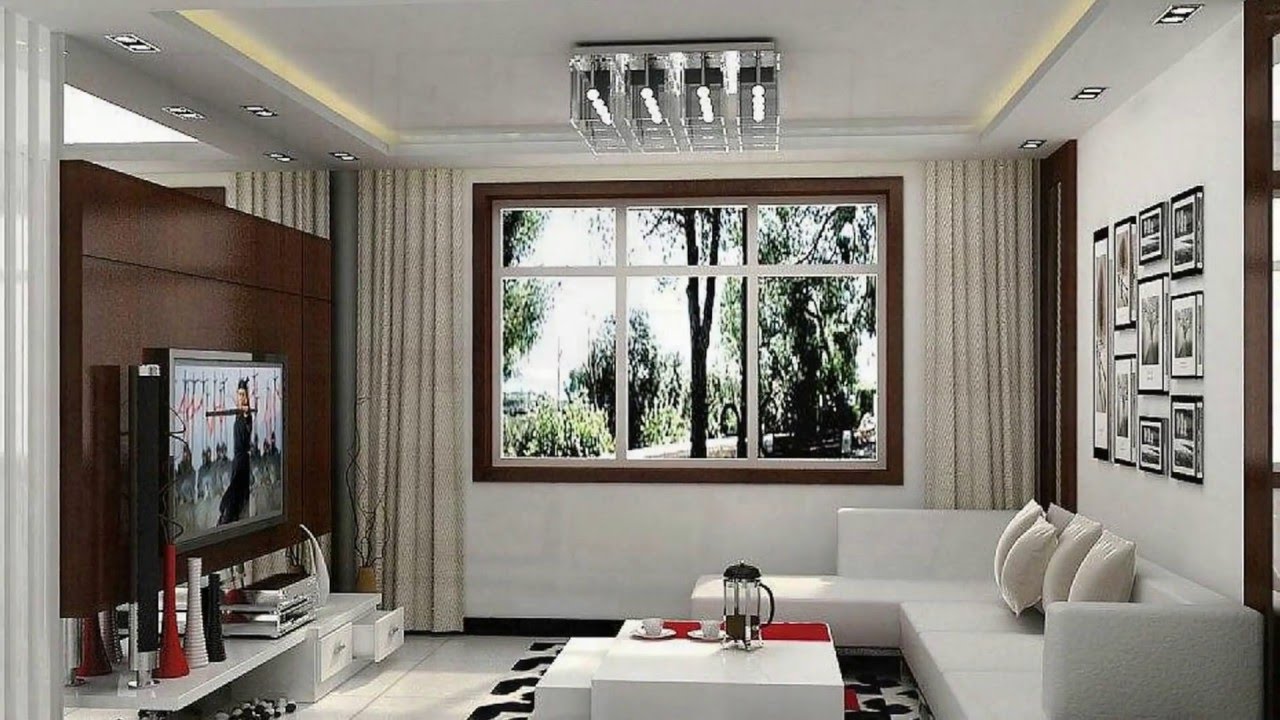Long living room with furniture away from the window.  Source: YouTube.com