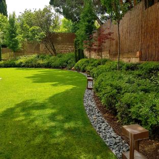 Backyard Landscaping Ideas Photo of a contemporary partial sun backyard landscaping in Madrid.  CFMRHYV