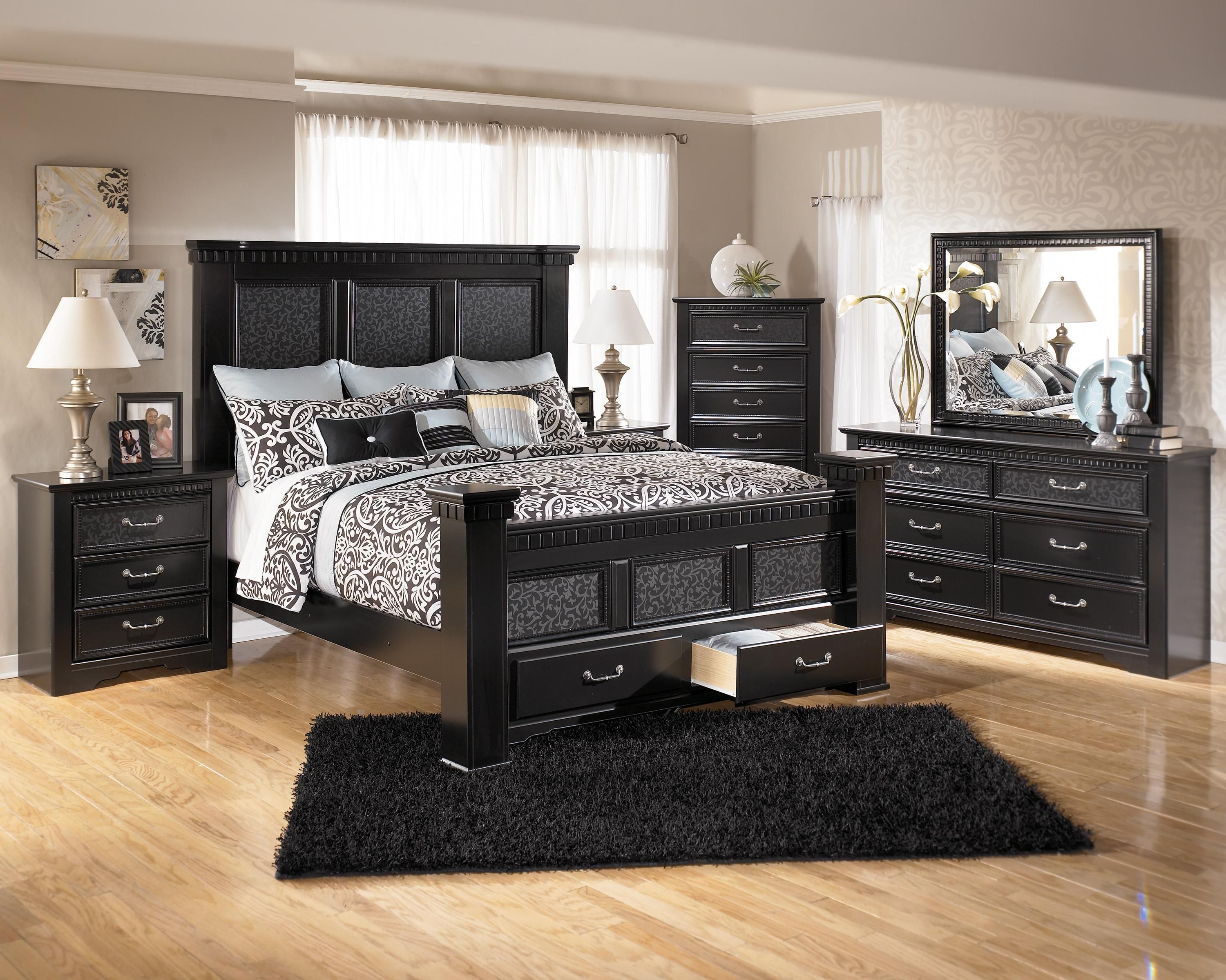 Black bedroom set Ashley Furniture Cavallino bedroom set with four-poster bed in mansion, footboard with storage space.  WLCBGQV
