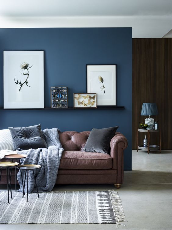blue living room ideas chic sitting area with brown sofa and navy blue accent wall CUYZKQE