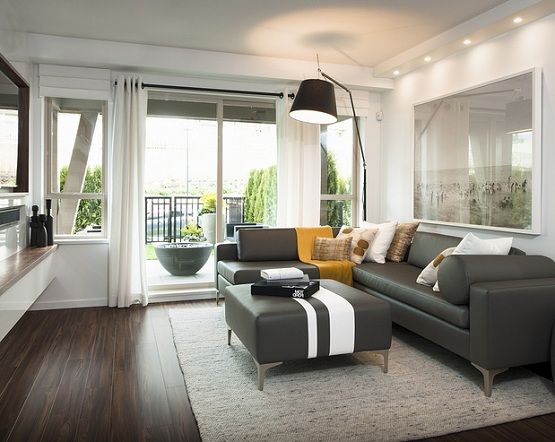 Living room with dark hardwood floors and contemporary sofa design and ...