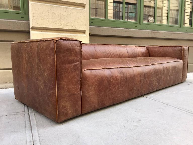 Leather sofa in used look Pair of 9 foot modern, brown leather sofas in used look with smoked oak DWPYCNC