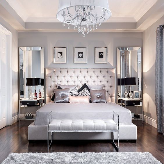 This gray bedroom is sleek and stylish with the tufted headboard.