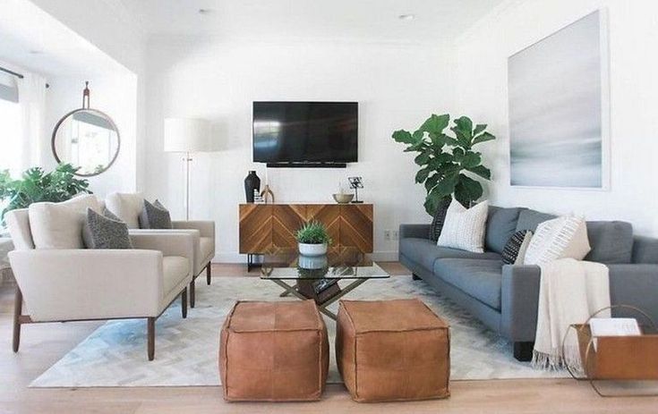 neutral simple living room // leather stool // gray sofa ...