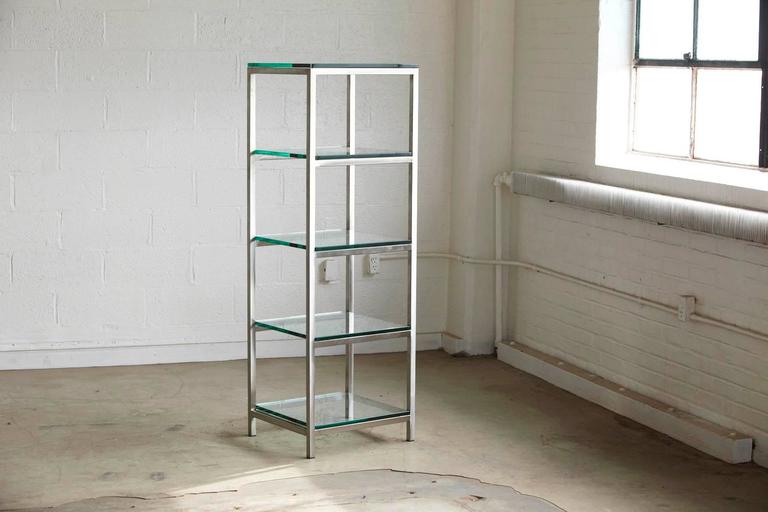 modern construction made of brushed aluminum tube with 5 x 3/8 thick glass shelves.  AXBOVVK
