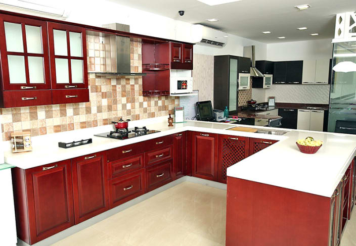 modular kitchen u-shaped kitchen with false ceiling and maroon cabinets WOZBMIA