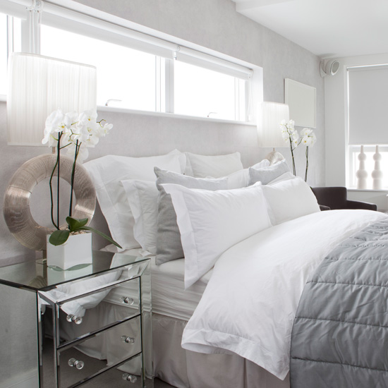 white bedroom white and gray bed under a long window ZMQOWGH