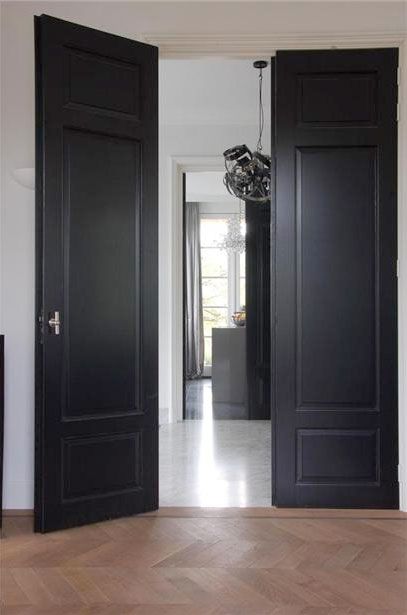 I like the floor to ceiling dark gray painted doors.  |  Gray.