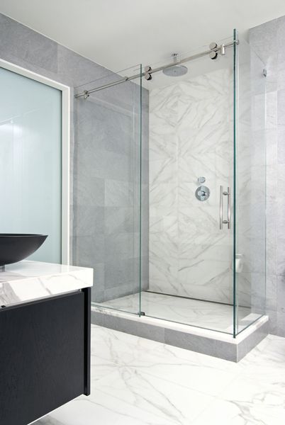 Welcome to Artistic Tile |  Sliding shower glass door, bathroom.