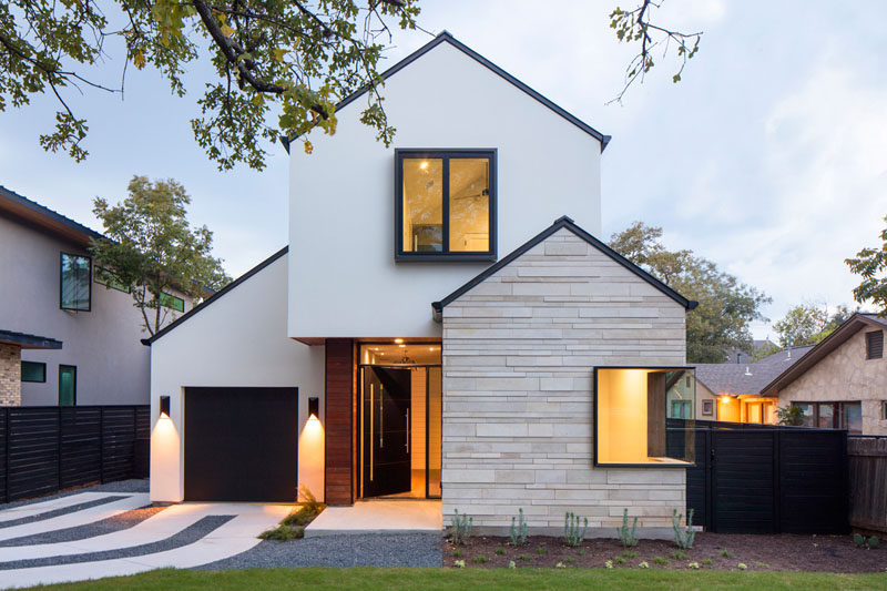 A contemporary house with pitched roofs arrives on this street.