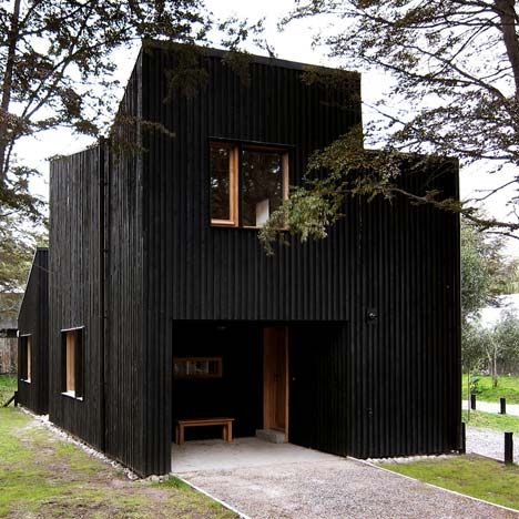 The architects Estudio BaBO have clad these three wooden houses.