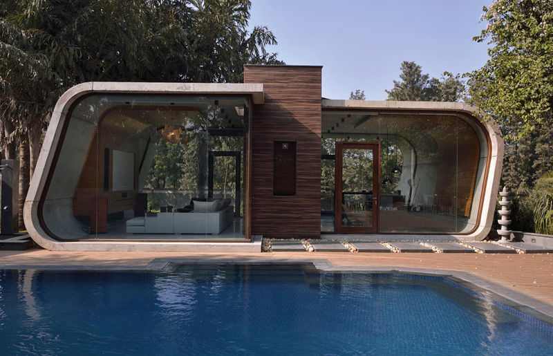 Curved concrete cabanas: modern pool house