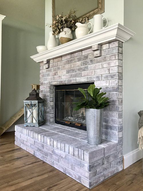 How to Whitewash a Brick Fireplace // Fireplace before and after.