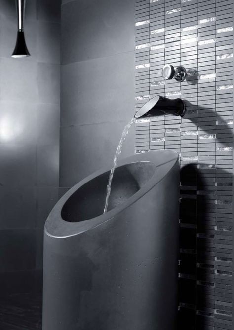 Black and white bathroom faucets and shower heads by Bongio.