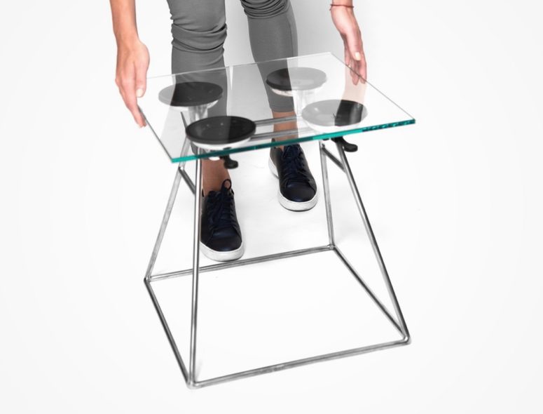 Edgy suction stool made of glass and metal