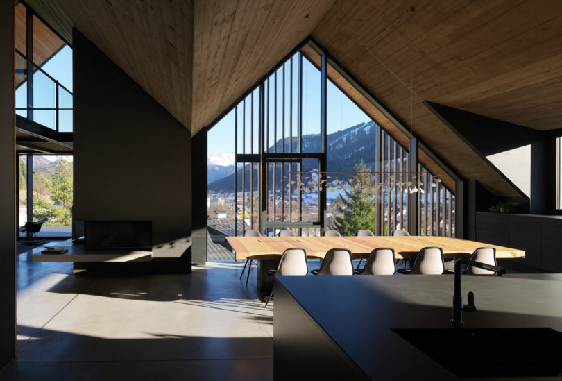 A holiday mountain house covered with wooden parasol in Tarvisio, Ita
