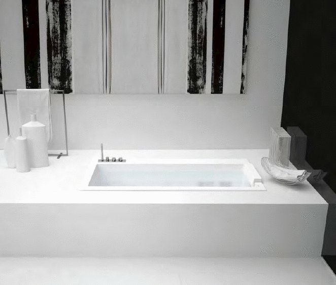 Minimalist bathtubs in White Corian Biblio by Antonio Lupi
