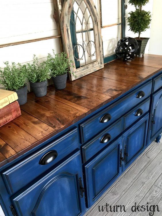 Cobalt blue kitchen cabinets with pallet wood countertops for a bold contrast