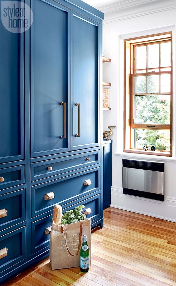 Parisian bistro style kitchen with bright blue cabinets
