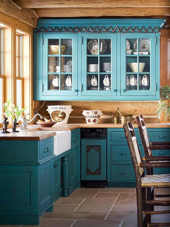 Vintage-style turquoise blue cabinets and lots of natural wood for a rustic vibe