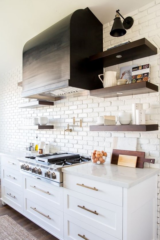 A chic farmhouse kitchen with a statement white brick wall that doubles as a kitchen backsplash