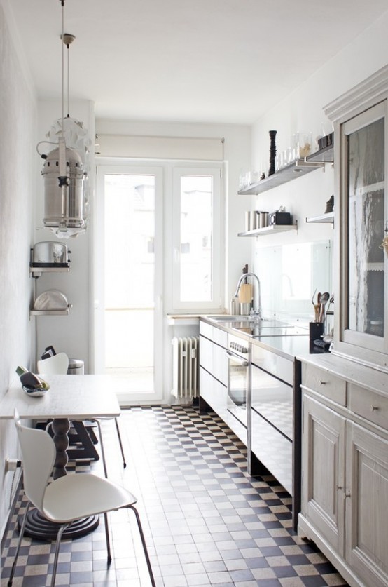 a vintage Scandinavian white kitchen with open shelves and cupboards, a rustic room with chairs and a carved wooden table and a mosaic floor