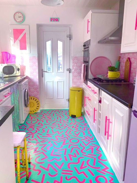 a bold, maximalist kitchen with pink block walls, purple cabinets, a bold neon print floor and neon yellow accents