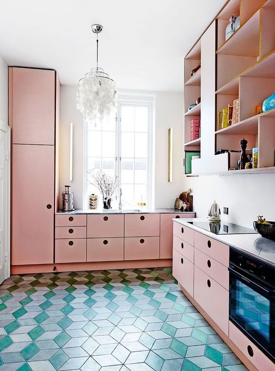 a bright pink kitchen with MDF cabinets, a white countertop and backsplash, and open storage cabinets upstairs