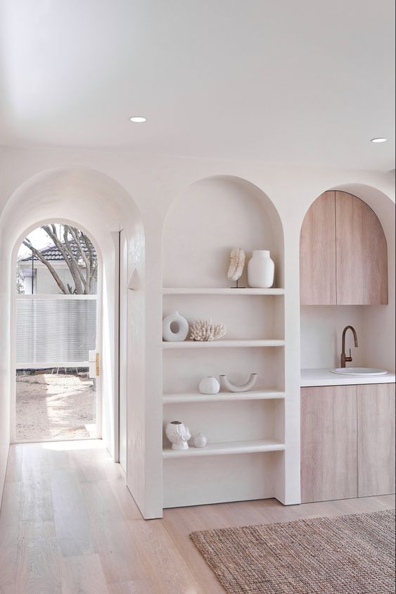 An arched niche with shelves and beautiful and stylish decor will add decorative value to your kitchen or other room