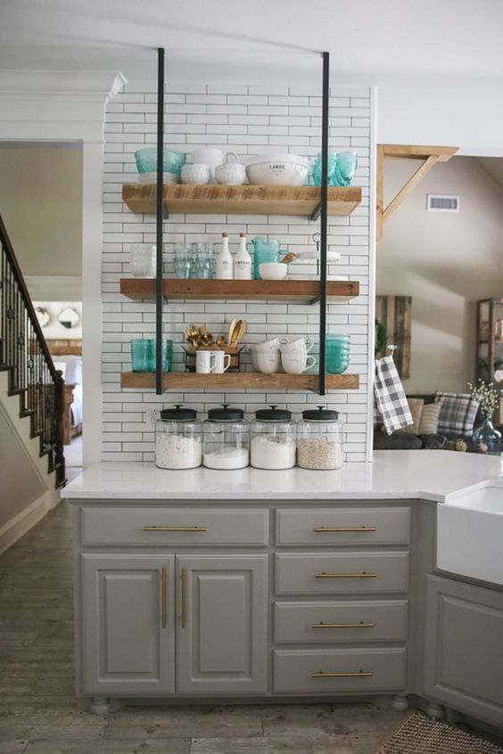 a gray farmhouse kitchen, a white tile backsplash and hanging shelves, white countertops for a rustic space