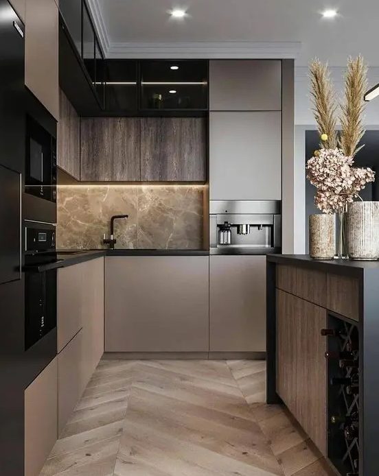 A sleek modern taupe kitchen with dark stained and taupe cabinets, gray marble and black fixtures, and black built-in appliances