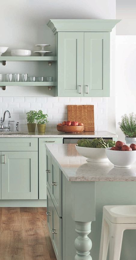 a cute green kitchen design