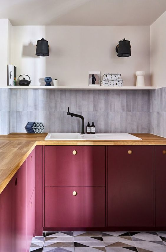 a bold purple kitchen with butcher block countertops, a gray slim tile backsplash and open shelving