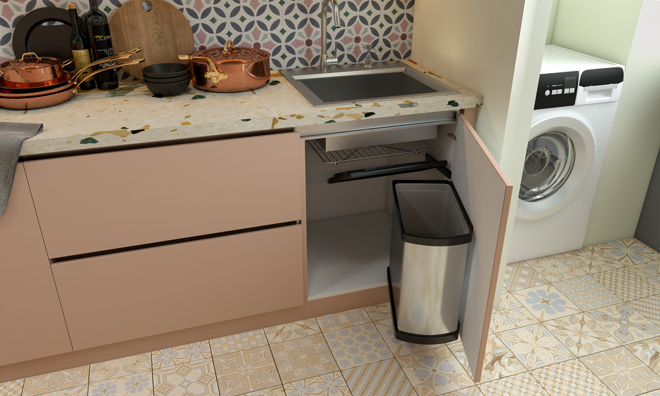 The modern stainless steel kitchen sink has a base cabinet with pull-out containers